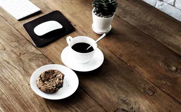 coffee and biscuit on table.