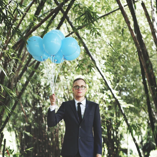 Businessman Holding Balloons — Stock Photo, Image