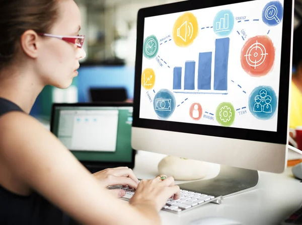 Businesswoman working on computer with growth — Stock Photo, Image