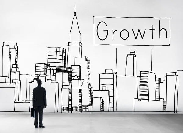 Бизнесмен и концепция роста — стоковое фото