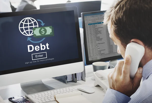 Businessman working on computer with Debt — Stock Photo, Image