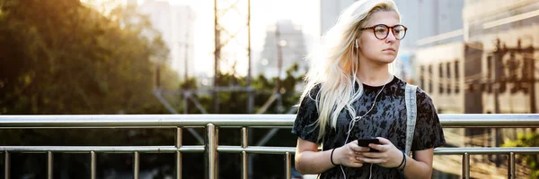 Young Girl Skater listening music — Stock Photo, Image