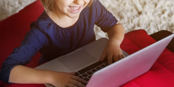 Little girl playing with Computer — Stock Photo, Image