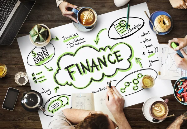 Tisch mit Poster mit Finanzen — Stockfoto