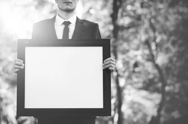 Businessman Holding Picture — Stok Foto