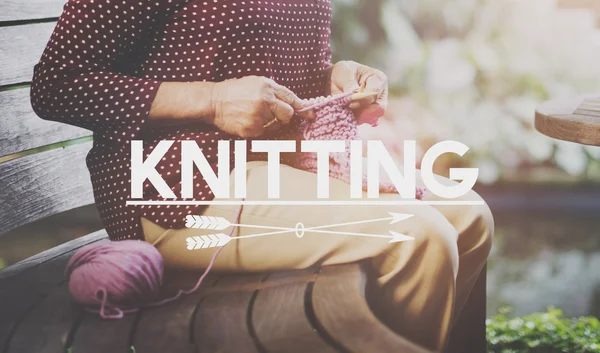 Elderly woman Knitting Scarf — Stock Photo, Image