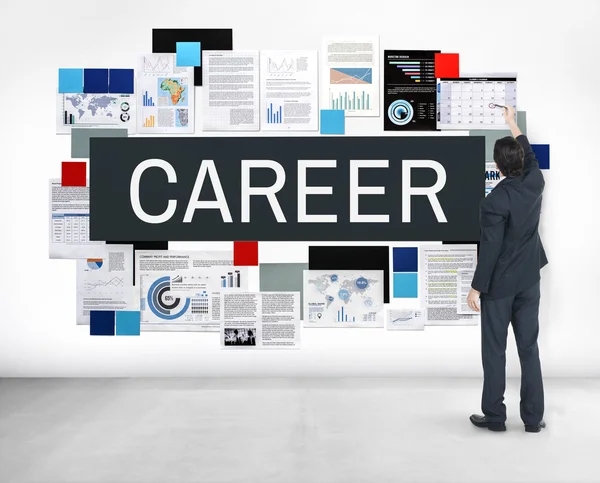 Businessman stands near wall — Stock Photo, Image