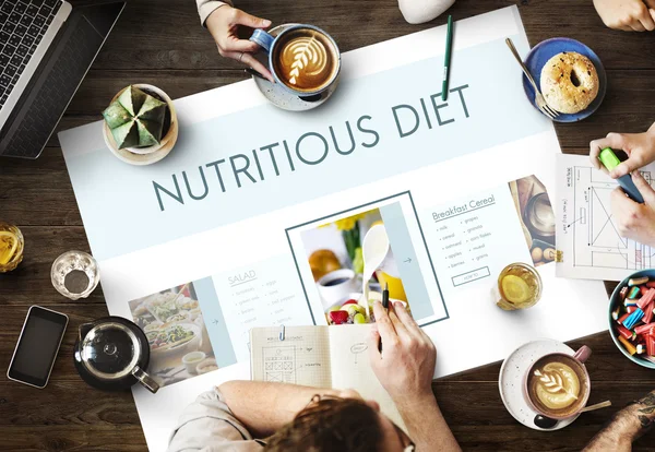 Mesa con póster con concepto de dieta nutritiva — Foto de Stock