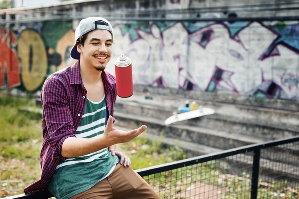 stock image boy with graffiti can