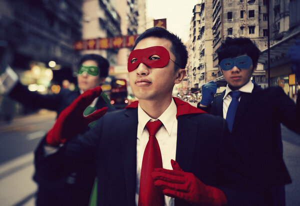 businessmen in superhero masks  