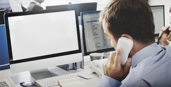 Businessman working on computer with white monitor — Stock Photo, Image