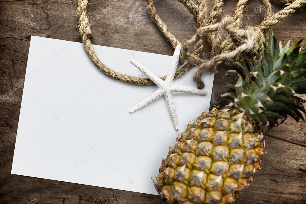 White paper on sand on wooden table