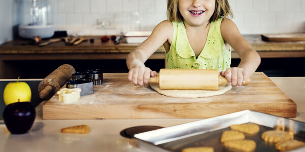 girl kneading dough for cookies