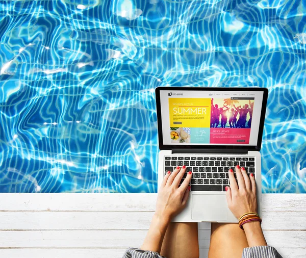 Woman in vacation working with laptop