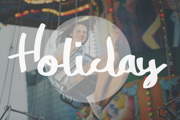 Girl riding on swing in Amusement Park — Stock Photo, Image