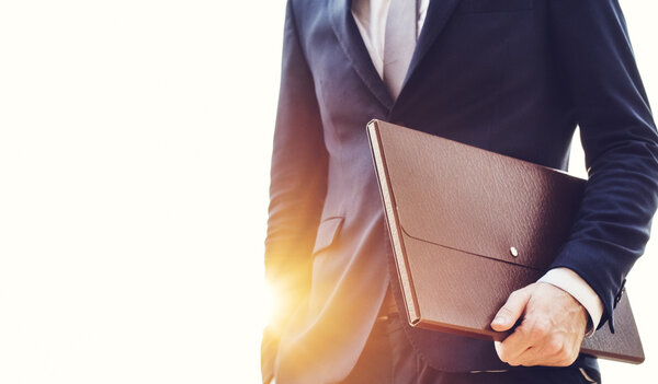 businessman holding briefcase