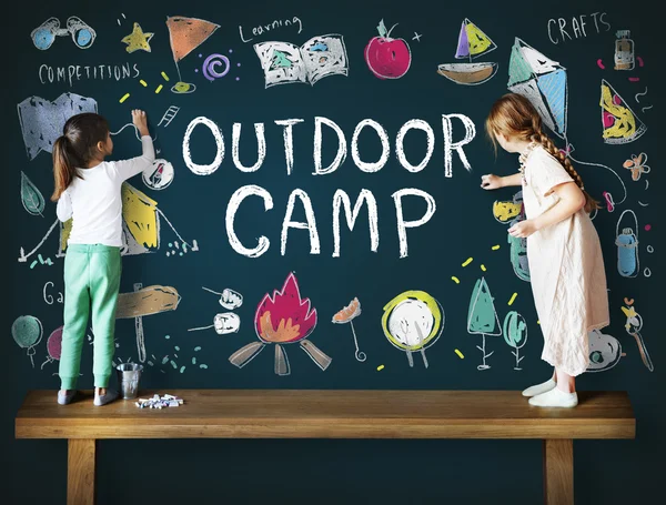 Kids drawing on blackboard — Stock Photo, Image