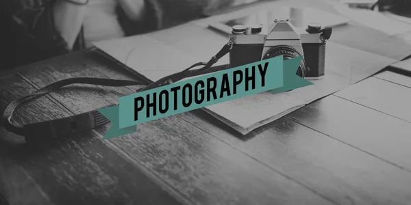 Vintage photo camera on table — Stock Photo, Image