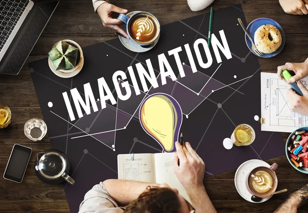 Mesa con póster con concepto de imaginación — Foto de Stock