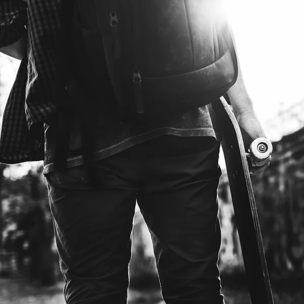 Hipster boy holding Skateboard — Stock Photo, Image