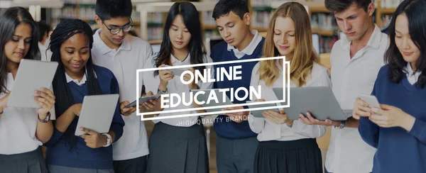 Students browsing digital gadgets — Stock Photo, Image