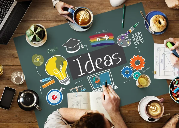 Mesa con póster con concepto de ideas — Foto de Stock