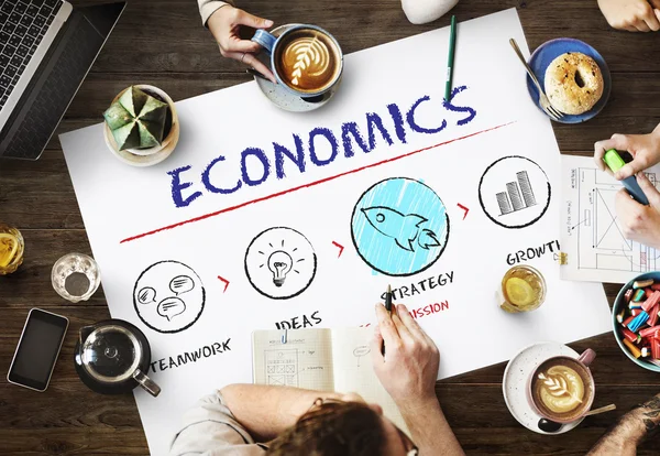 Mesa con póster con concepto económico — Foto de Stock