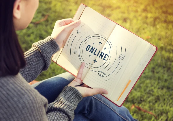 Woman looking in diary — Stock Photo, Image