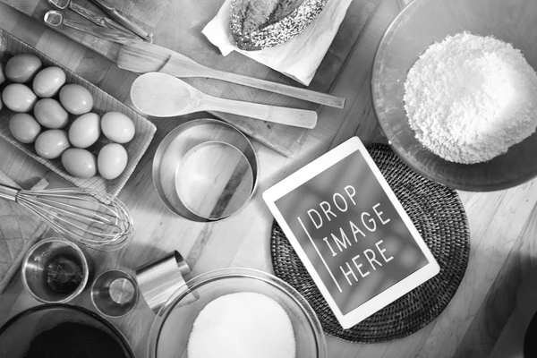 Digital tablet on kitchen table — Stock Photo, Image