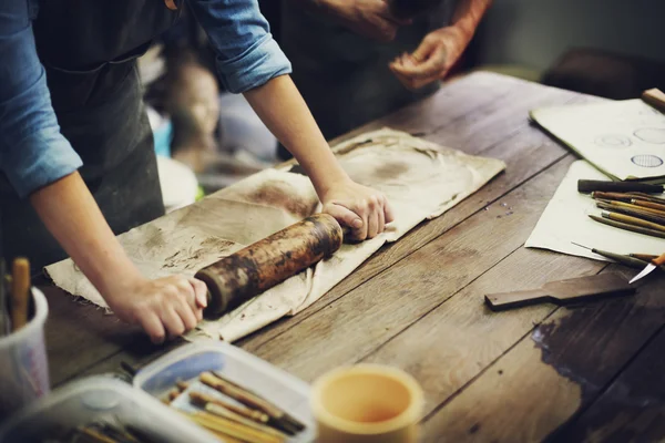 Craftsman working with rolling pin — Stock Photo, Image