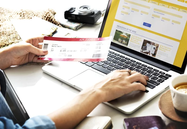 woman with ticket booking flight