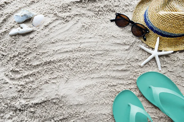 sand with summer sandals and glasses