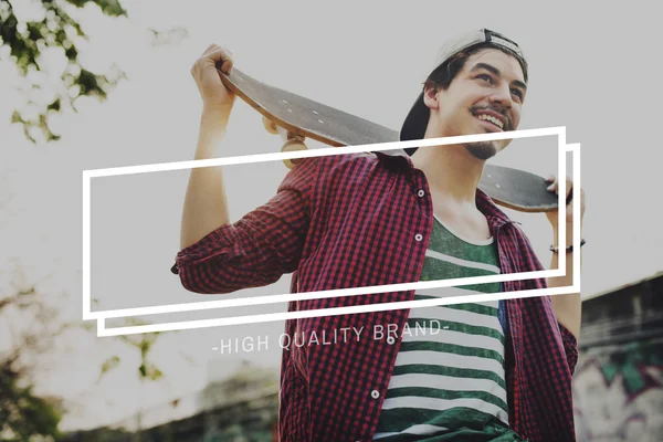 Hipster boy holding Skateboard — Stockfoto