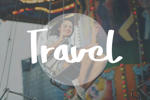 Woman riding on swing in Amusement Park — Stock Photo, Image