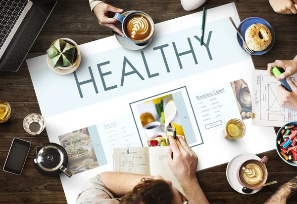Mesa com cartaz com conceito saudável — Fotografia de Stock