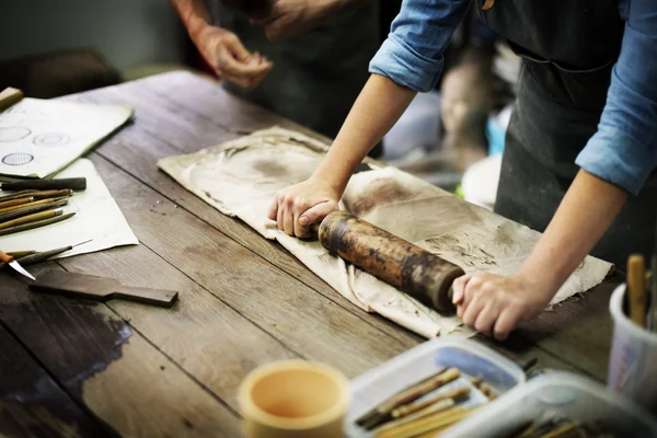 Craftsman working with rolling pin — Stock Photo, Image