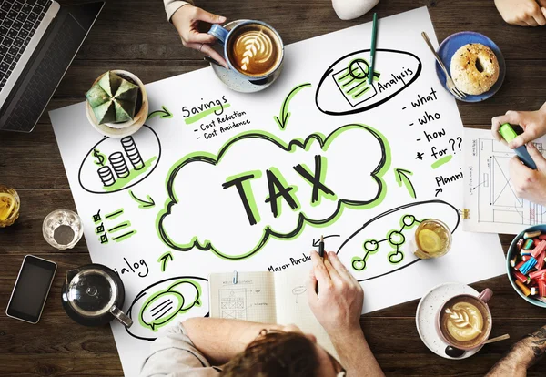 Mesa con póster con concepto Tax — Foto de Stock