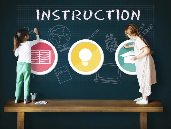 Little Girls drawing on Blackboard — Stock Photo, Image