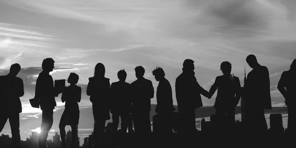 Business People silhouettes on sunset — Stock Photo, Image