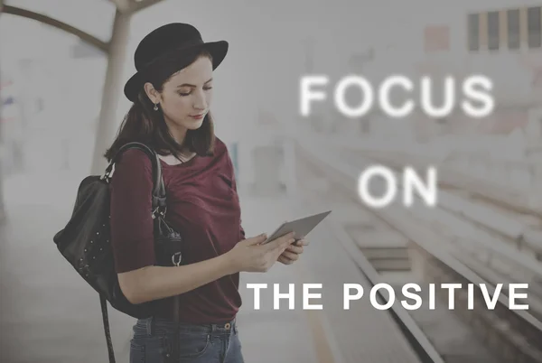 Woman in hat browsing digital tablet — Stock Photo, Image