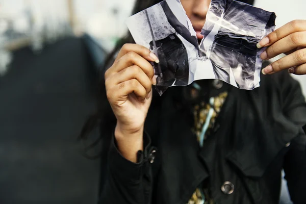 African Girl tearing photo — Stock Photo, Image