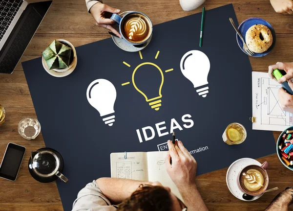 Mesa con póster con concepto de ideas — Foto de Stock