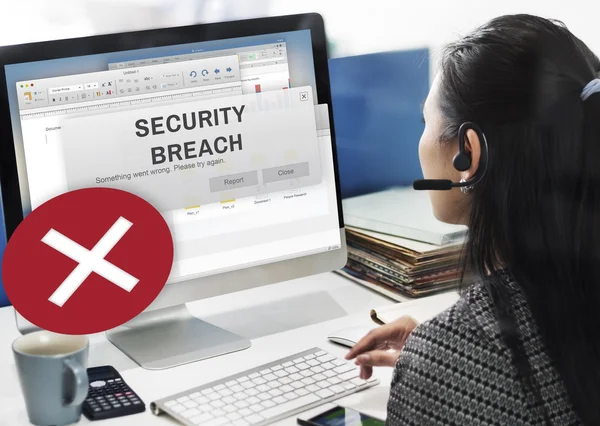 Businesswoman working on computer with Security Breach — Stock Photo, Image