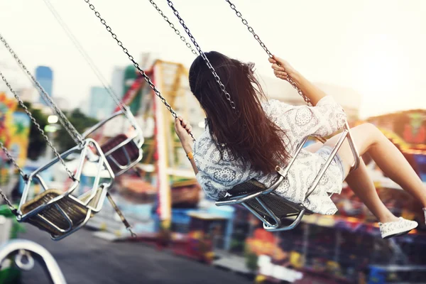 Girl riding on swing — Stock Photo, Image