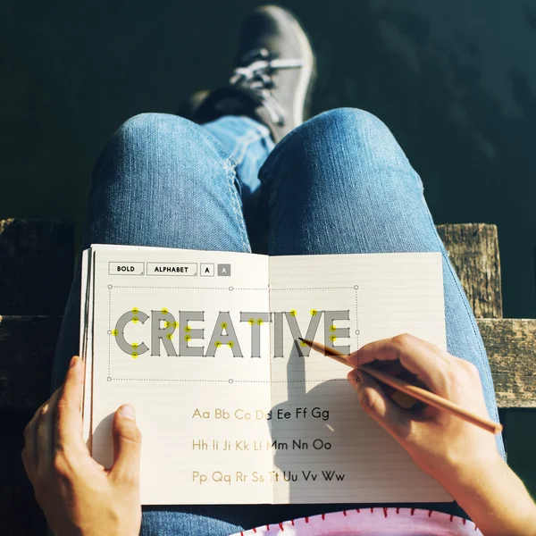 Girl making notes in diary — Stock Photo, Image