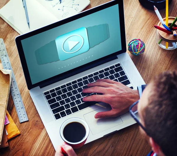 Man working with laptop and drinking coffee — Stock Photo, Image