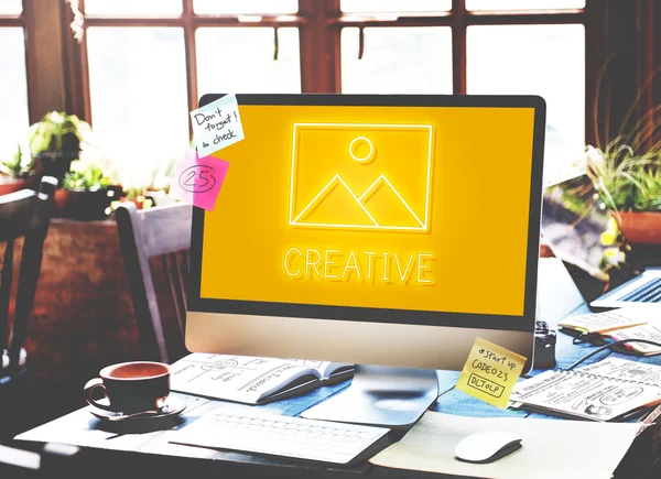 Computer monitor on workplace table — Stock Photo, Image