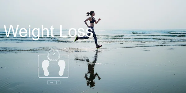 Mujer corriendo en la playa —  Fotos de Stock