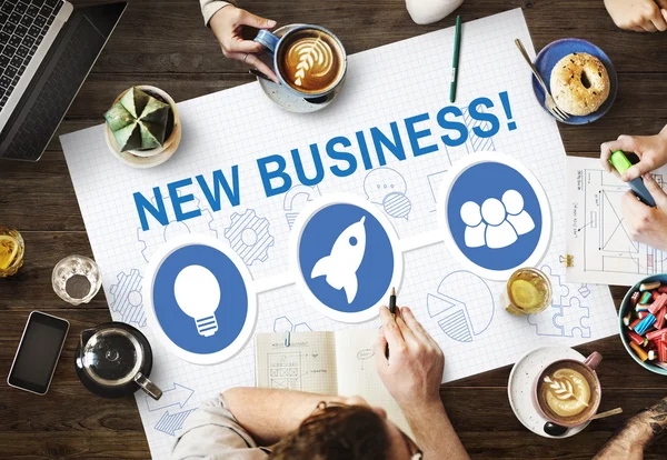 Table avec poster avec concept New Business — Photo