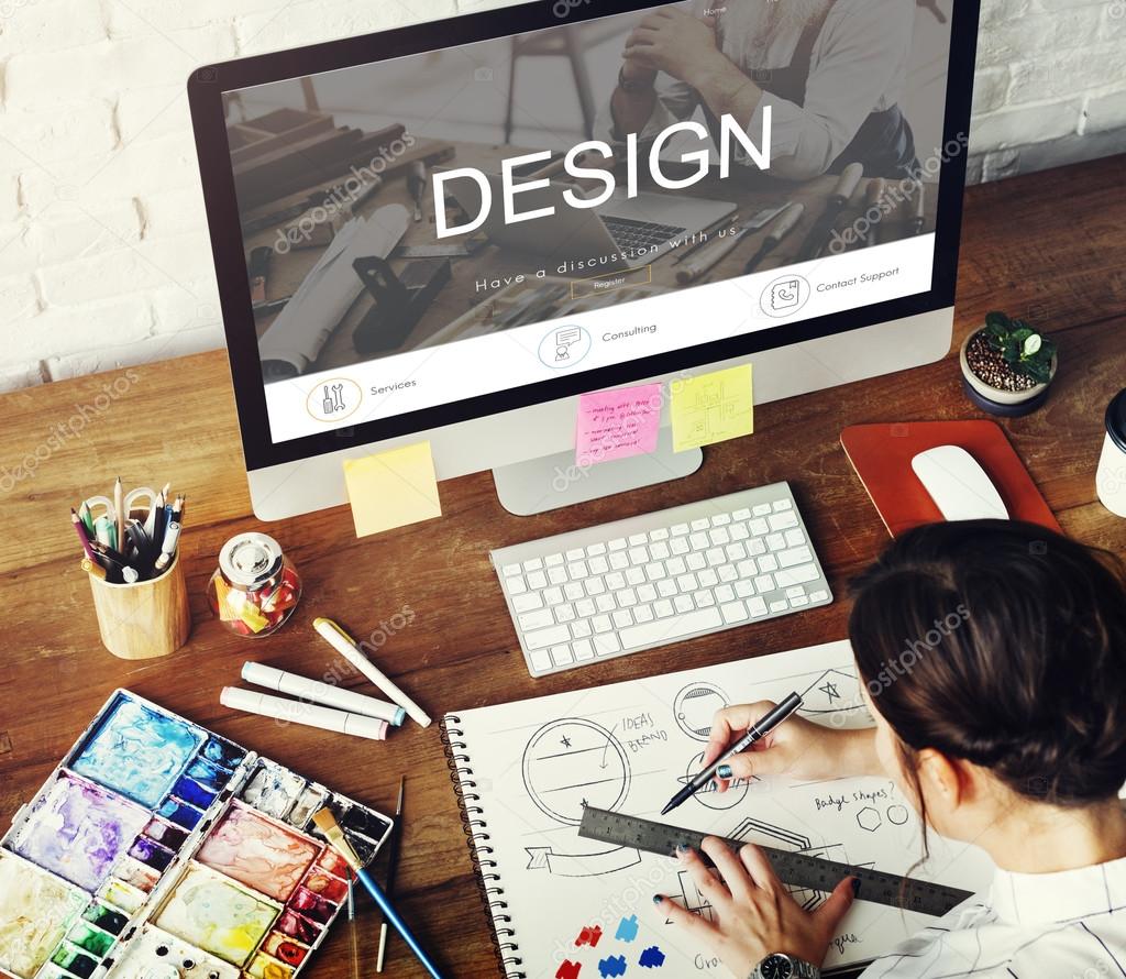 Creative woman drawing in album, computer monitor with text: Design